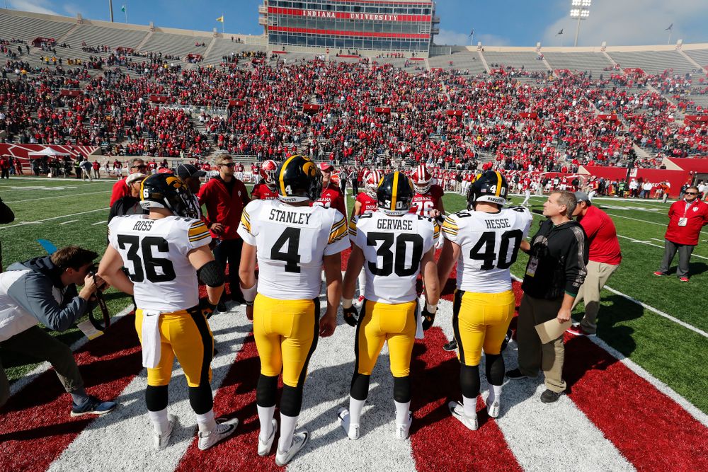 Iowa Hawkeyes captains defensive end Parker Hesse (40), defensive back Jake Gervase (30), quarterback Nate Stanley (4), and fullback Brady Ross against the Indiana Hoosiers Saturday, October 13, 2018 at Memorial Stadium, in Bloomington, Ind. (Brian Ray/hawkeyesports.com)