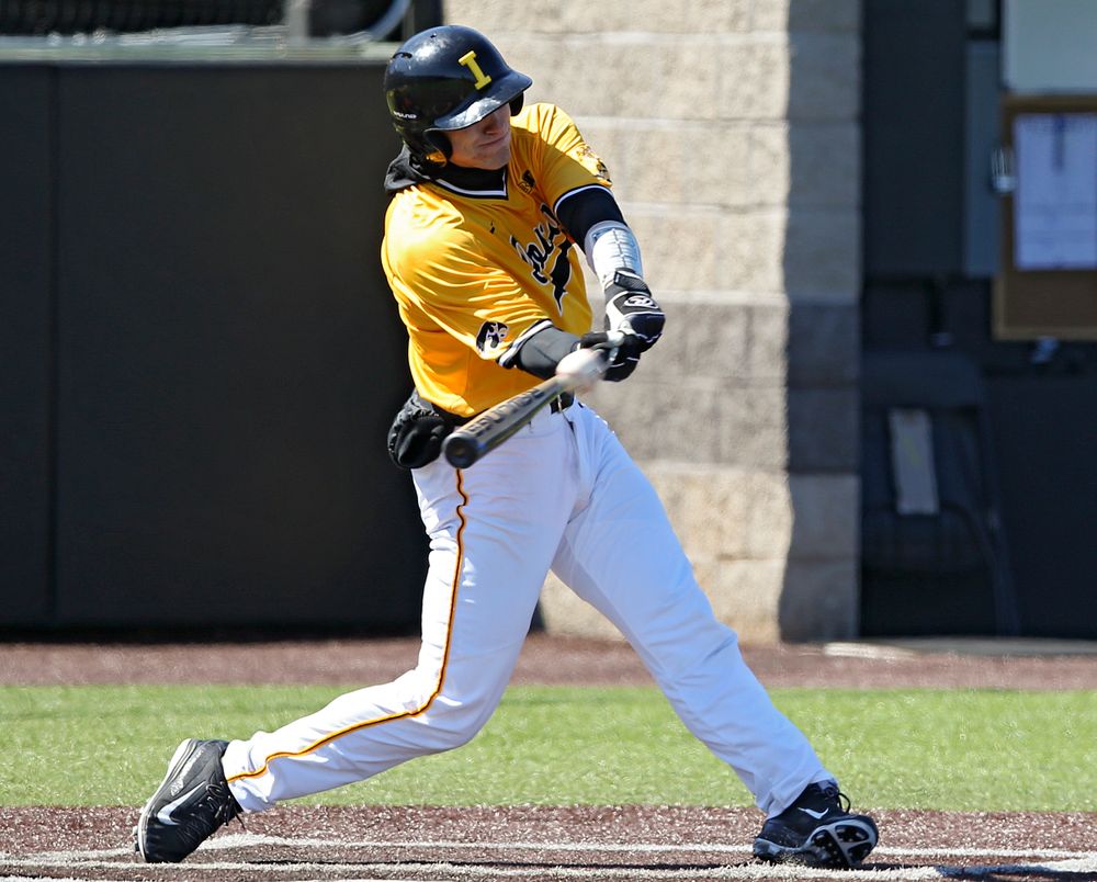 Iowa Hawkeyes catcher Austin Martin (34) hits a 2-run triple during the third inning against Illinois at Duane Banks Field in Iowa City on Sunday, Mar. 31, 2019. (Stephen Mally/hawkeyesports.com)