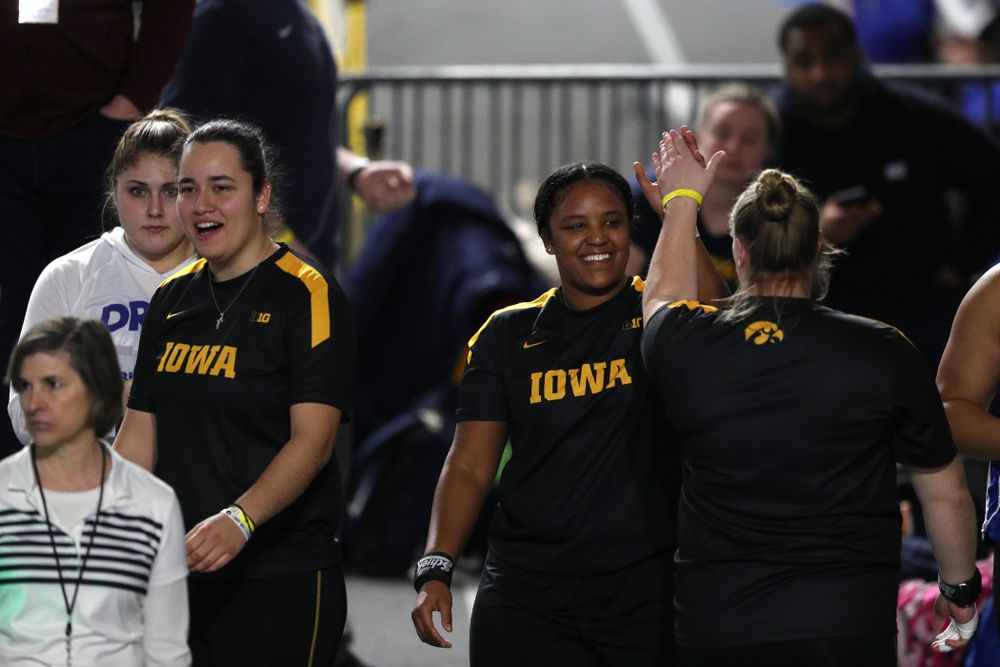 Iowa's Nia Britt high fives Erika Hammond as they compete  in the Shot Put during the Black and Gold Premier meet Saturday, January 26, 2019 at the Recreation Building. (Brian Ray/hawkeyesports.com)