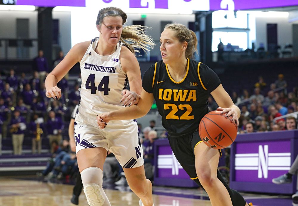 Iowa Hawkeyes guard Kathleen Doyle (22) drives with the ball during the first quarter of their game at Welsh-Ryan Arena in Evanston, Ill. on Sunday, January 5, 2020. (Stephen Mally/hawkeyesports.com)