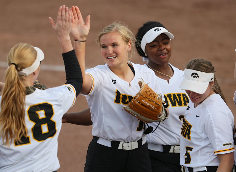 Iowa pitcher Sarah Lehman (16) gets a high-five from third baseman Ashley Hamilton (18) after ending the fifth inning of their game against Ohio State at Pearl Field in Iowa City on Friday, May. 3, 2019. (Stephen Mally/hawkeyesports.com)