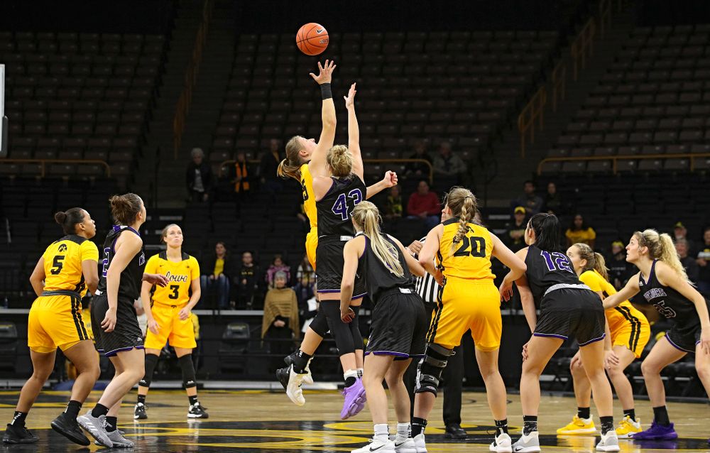 Iowa forward/center Monika Czinano (25) wins the opening tip during the first quarter of their game against Winona State at Carver-Hawkeye Arena in Iowa City on Sunday, Nov 3, 2019. (Stephen Mally/hawkeyesports.com)