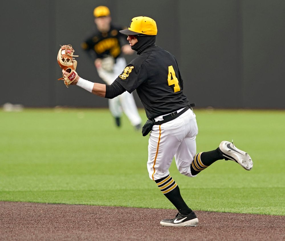 Iowa Hawkeyes second baseman Mitchell Boe (4) snags a line drive during the fourth inning of their game against Illinois at Duane Banks Field in Iowa City on Saturday, Mar. 30, 2019. (Stephen Mally/hawkeyesports.com)