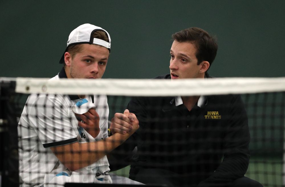 Iowa's Will Davies and Iowa assistant coach Joey Manilla against Western Michigan Saturday, January 19, 2019 at the Hawkeye Tennis and Recreation Complex. (Brian Ray/hawkeyesports.com)