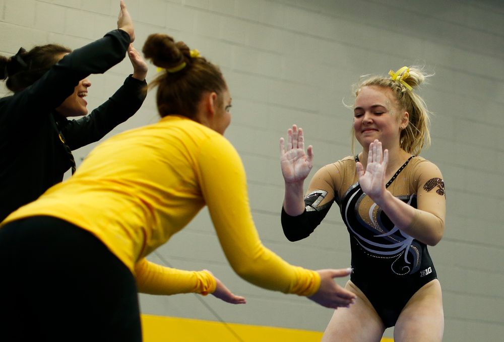 Charlotte Sullivan celebrates after competing on the vault during the Black and Gold Intrasquad meet at the Field House on 12/2/17. (Tork Mason/hawkeyesports.com)