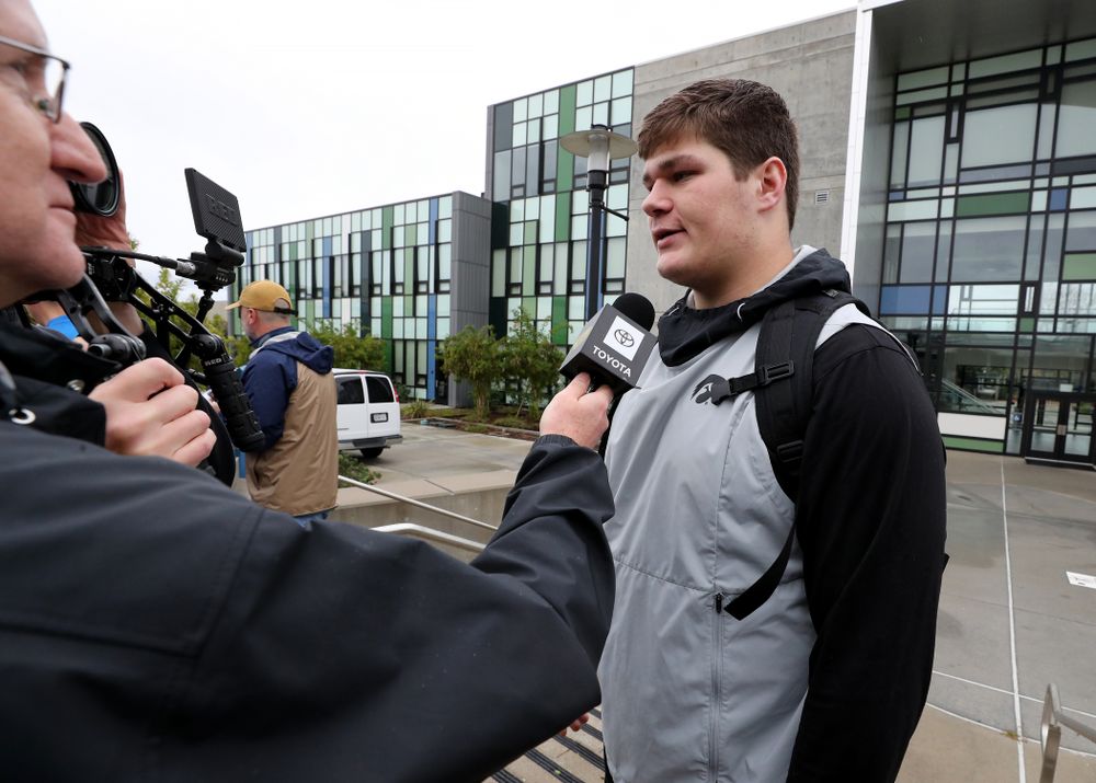 Iowa Hawkeyes offensive lineman Tyler Linderbaum (65) answers questions from the media following practice Monday, December 23, 2019 at Mesa College in San Diego. (Brian Ray/hawkeyesports.com)
