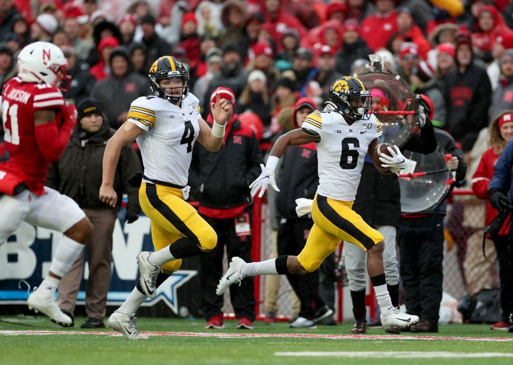   Iowa Hawkeyes quarterback Nate Stanley (4) blocks for wide receiver Ihmir Smith-Marsette (6) on his way to a touchdown against the Nebraska Cornhuskers Friday, November 29, 2019 at Memorial Stadium in Lincoln, Neb. (Brian Ray/hawkeyesports.com)