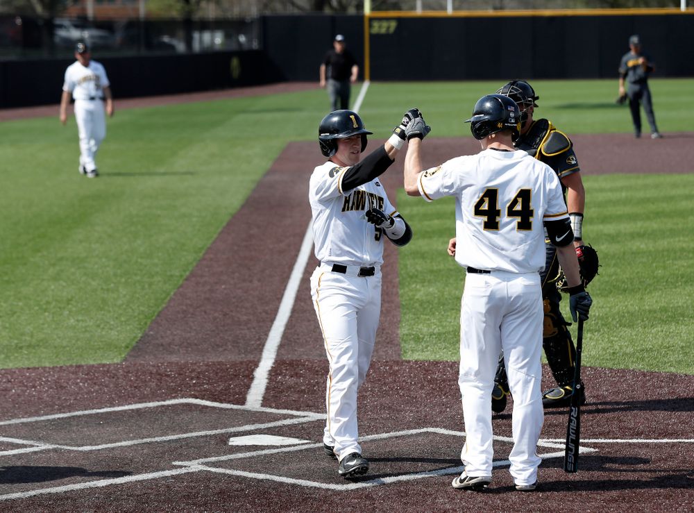 Iowa Hawkeyes catcher Tyler Cropley (5) celebrates with outfielder Robert Neustrom (44) after hitting a home run against the Missouri Tigers Tuesday, May 1, 2018 at Duane Banks Field. (Brian Ray/hawkeyesports.com)