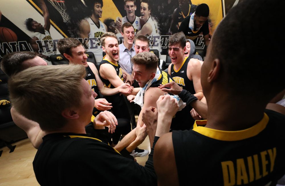 Iowa Hawkeyes guard Jordan Bohannon (3) celebrates with his teammates after defeating the Indiana Hoosiers in overtime Friday, February 22, 2019 at Carver-Hawkeye Arena. (Brian Ray/hawkeyesports.com)