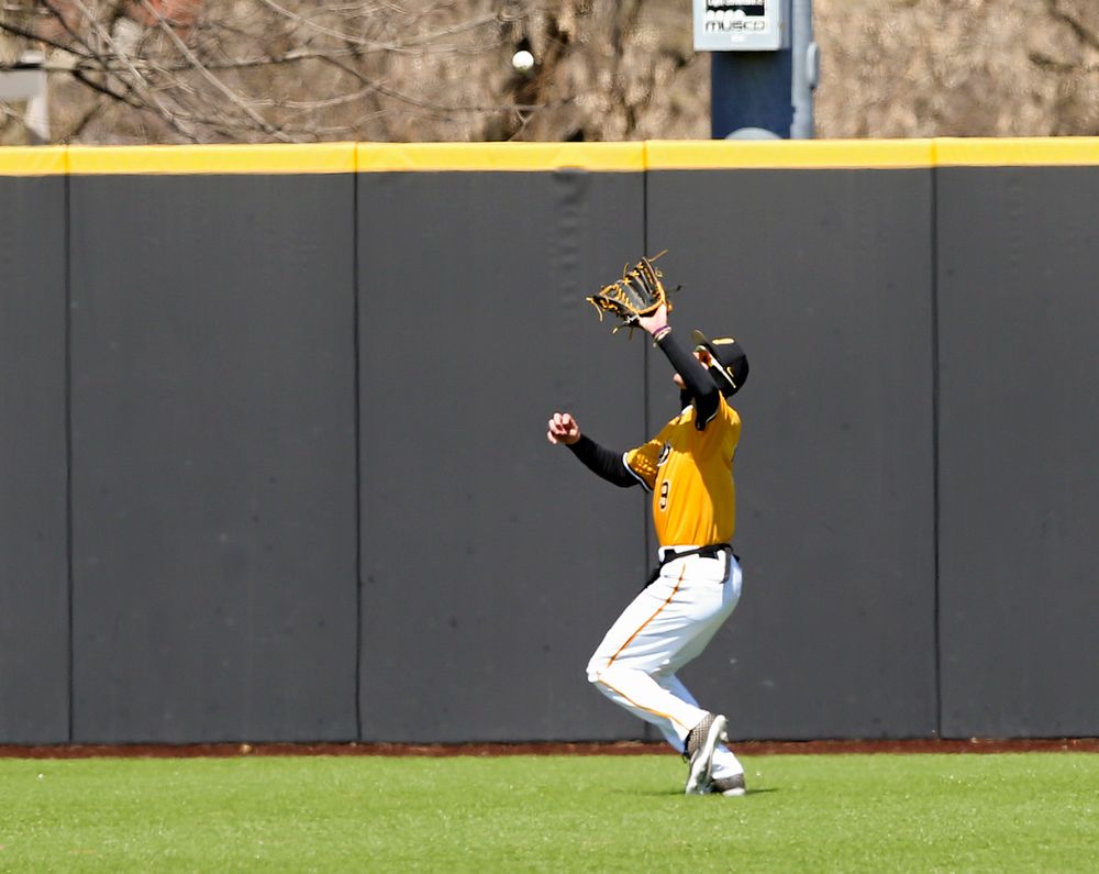 Iowa Hawkeyes center fielder Ben Norman (9) pulls in a fly ball for an out during the first inning against Illinois at Duane Banks Field in Iowa City on Sunday, Mar. 31, 2019. (Stephen Mally/hawkeyesports.com)