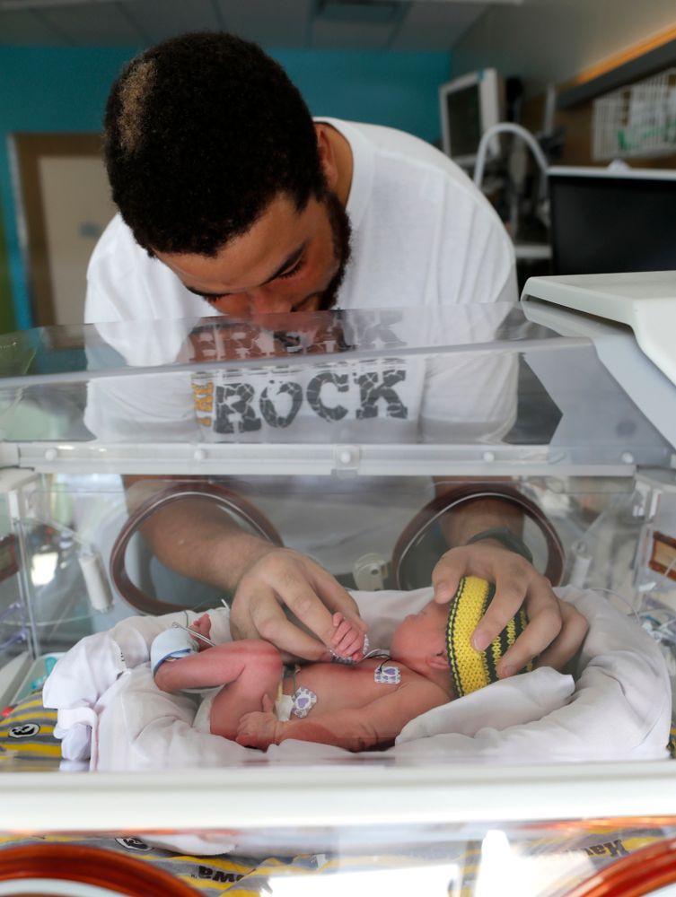 Iowa Hawkeyes offensive lineman Dalton Ferguson (76) and his girlfriend Rachael stand with their newborn twins Ella and Hazel Wednesday, September 12, 2018 in the NICU at the Stead Family Children's Hospital (Brian Ray/hawkeyesports.com)