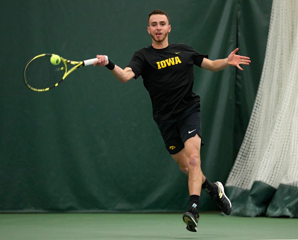 Iowa’s Kareem Allaf returns a shot during his singles match at the Hawkeye Tennis and Recreation Complex in Iowa City on Friday, March 6, 2020. (Stephen Mally/hawkeyesports.com)