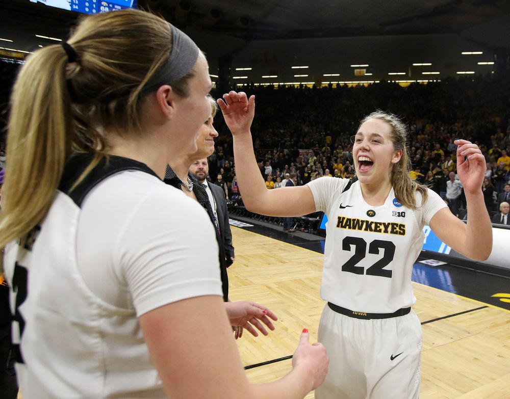 Iowa Hawkeyes guard Kathleen Doyle (22) and guard Makenzie Meyer (3) celebrate after winning their second round game in the 2019 NCAA Women's Basketball Tournament at Carver Hawkeye Arena in Iowa City on Sunday, Mar. 24, 2019. (Stephen Mally for hawkeyesports.com)