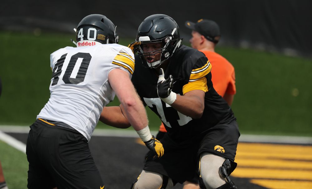 Iowa Hawkeyes offensive lineman Alaric Jackson (77) against defensive end Parker Hesse (40) during the third practice of fall camp Sunday, August 5, 2018 at the Kenyon Football Practice Facility. (Brian Ray/hawkeyesports.com)