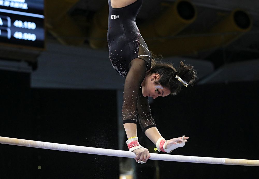 Iowa’s Carina Tolan competes on the bars during their meet at Carver-Hawkeye Arena in Iowa City on Sunday, March 8, 2020. (Stephen Mally/hawkeyesports.com)