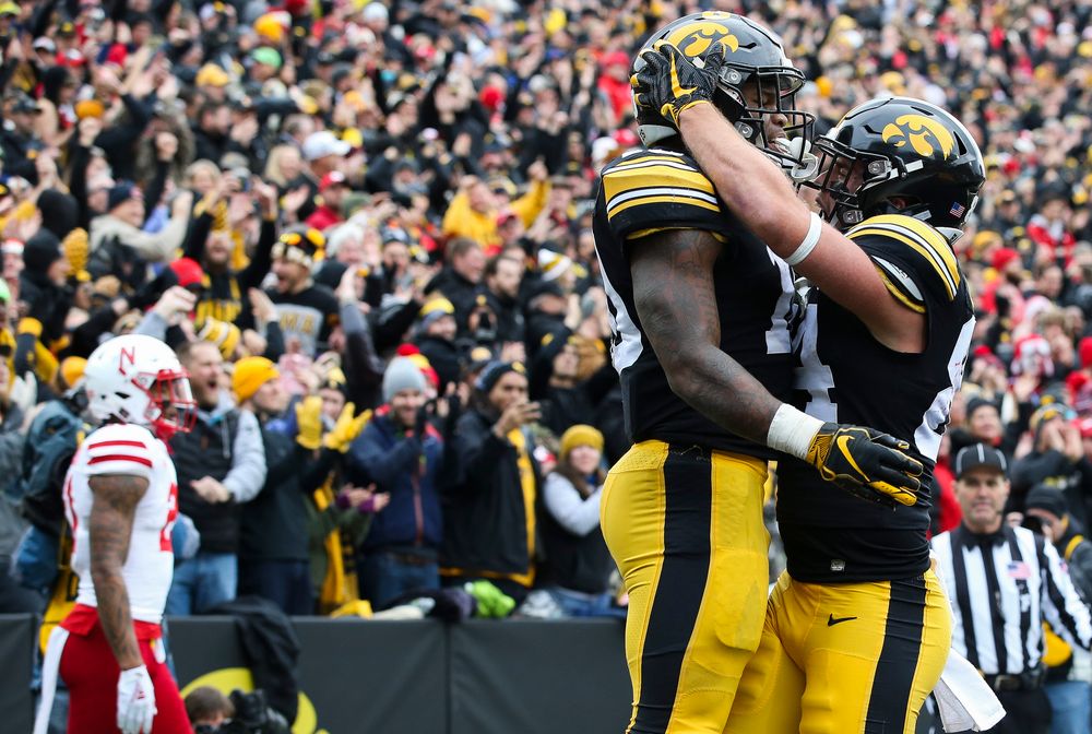 Iowa Hawkeyes running back Mekhi Sargent (10) and Iowa Hawkeyes wide receiver Nick Easley (84) celebrate after Sargent's touchdown during a game against Nebraska at Kinnick Stadium on November 23, 2018. (Tork Mason/hawkeyesports.com)