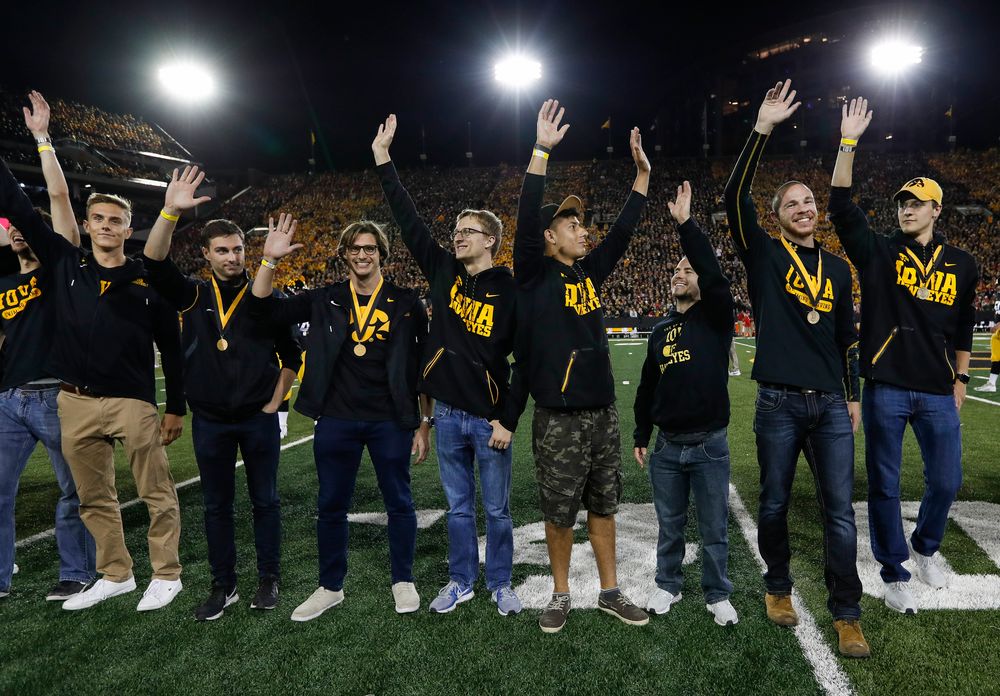Members of the Iowa men's swimming and diving team are recognized by the Presidential Committee on Athletics at halftime during a game against Wisconsin on September 22, 2018. (Tork Mason/hawkeyesports.com)