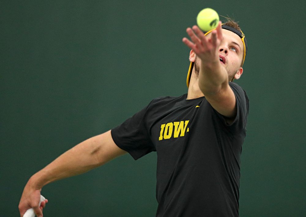 Iowa’s Will Davies serves during his match against Marquette at the Hawkeye Tennis and Recreation Complex in Iowa City on Saturday, January 25, 2020. (Stephen Mally/hawkeyesports.com)