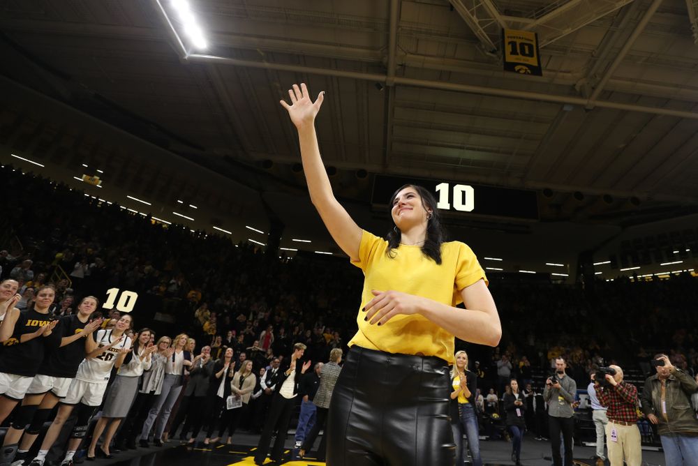 Megan Gustafson waves to the fans after her number was raised into the rafters during a jersey retirement ceremony Sunday, January 26, 2020 at Carver-Hawkeye Arena. (Brian Ray/hawkeyesports.com)