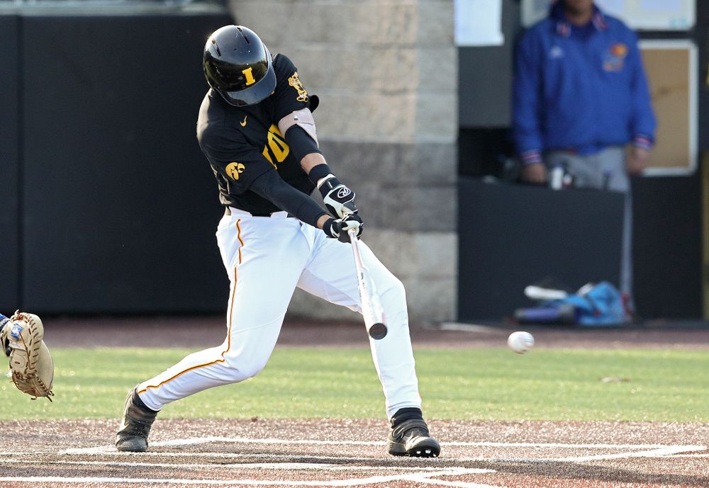 Iowa shortstop Dylan Nedved (17) hits an RBI single during the third inning of their college baseball game at Duane Banks Field in Iowa City on Tuesday, March 10, 2020. (Stephen Mally/hawkeyesports.com)