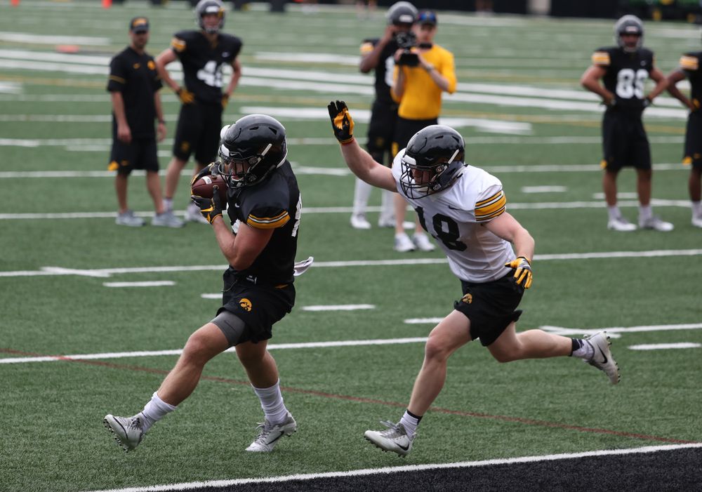and defensive back John Milani (18) during practice No. 4 of Fall Camp Monday, August 6, 2018 at the Hansen Football Performance Center. (Brian Ray/hawkeyesports.com)