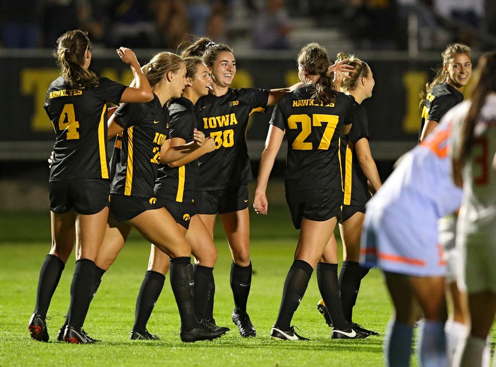 Iowa forward Devin Burns (30) celebrates her goal with teammates during the first half of their match against Illinois at the Iowa Soccer Complex in Iowa City on Thursday, Sep 26, 2019. (Stephen Mally/hawkeyesports.com)