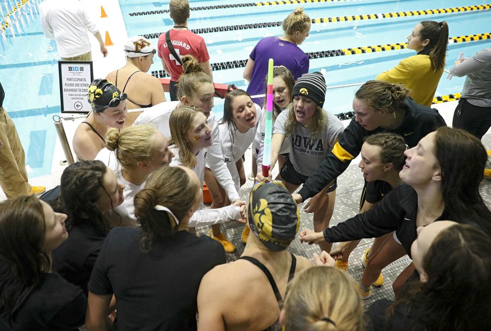 The Hawkeyes huddle during the 2020 Women’s Big Ten Swimming and Diving Championships at the Campus Recreation and Wellness Center in Iowa City on Friday, February 21, 2020. (Stephen Mally/hawkeyesports.com)