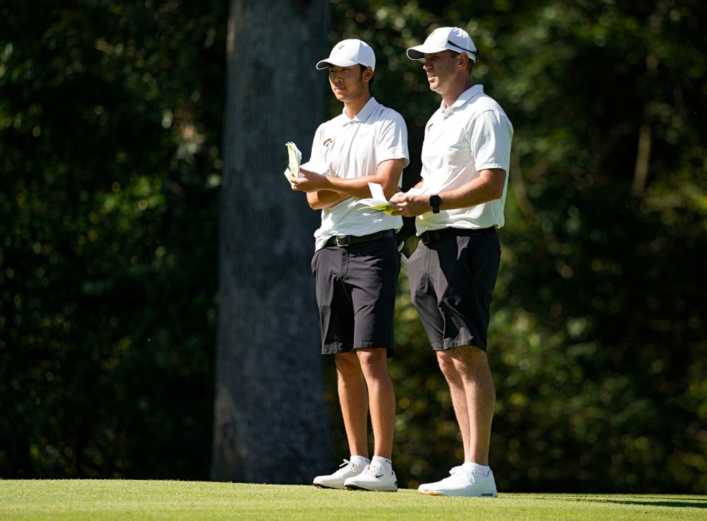 Iowa’s Joe Kim (from left) talks with head coach Tyler Stith during the second day of the Golfweek Conference Challenge at the Cedar Rapids Country Club in Cedar Rapids on Monday, Sep 16, 2019. (Stephen Mally/hawkeyesports.com)