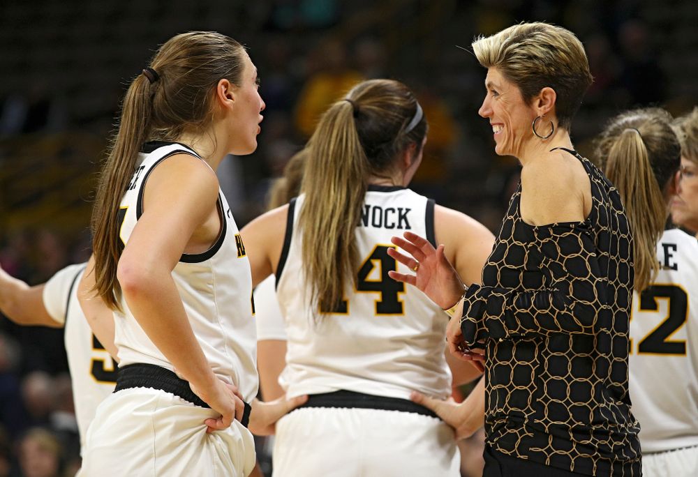 Iowa forward Amanda Ollinger (43) talks with associate head coach Jan Jensen during overtime in their win against Princeton at Carver-Hawkeye Arena in Iowa City on Wednesday, Nov 20, 2019. (Stephen Mally/hawkeyesports.com)