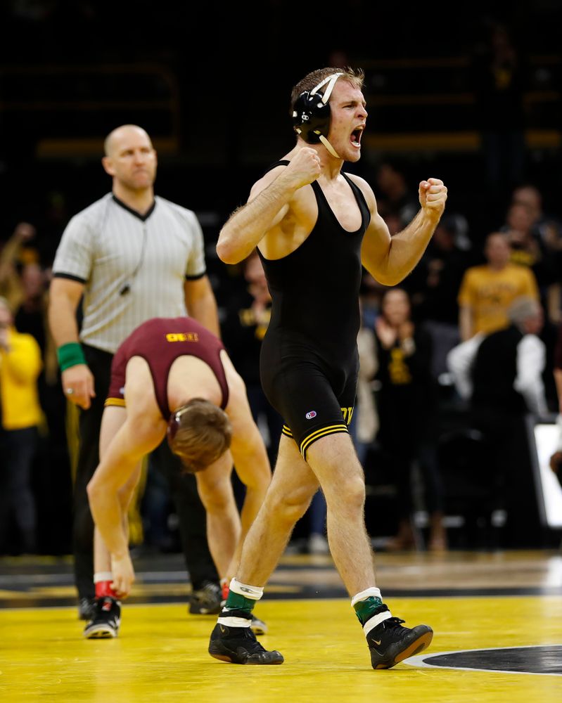 Iowa's Carter Happel wrestles Minnesota's Tommy Thorn at 141 pounds