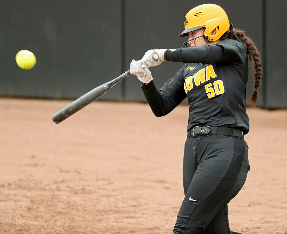 Iowa infielder Kalena Burns (50) hits a double during the fourth inning of their game against Iowa Softball vs Indian Hills Community College at Pearl Field in Iowa City on Sunday, Oct 6, 2019. (Stephen Mally/hawkeyesports.com)