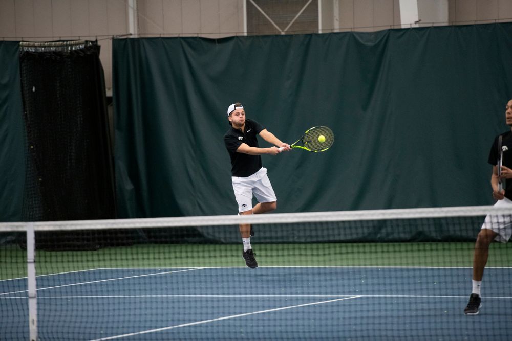 The Iowa men's tennis team competes against Cornell in The Rise Tennis Center in Ithaca, NY on Sunday, Feb. 24, 2019. 