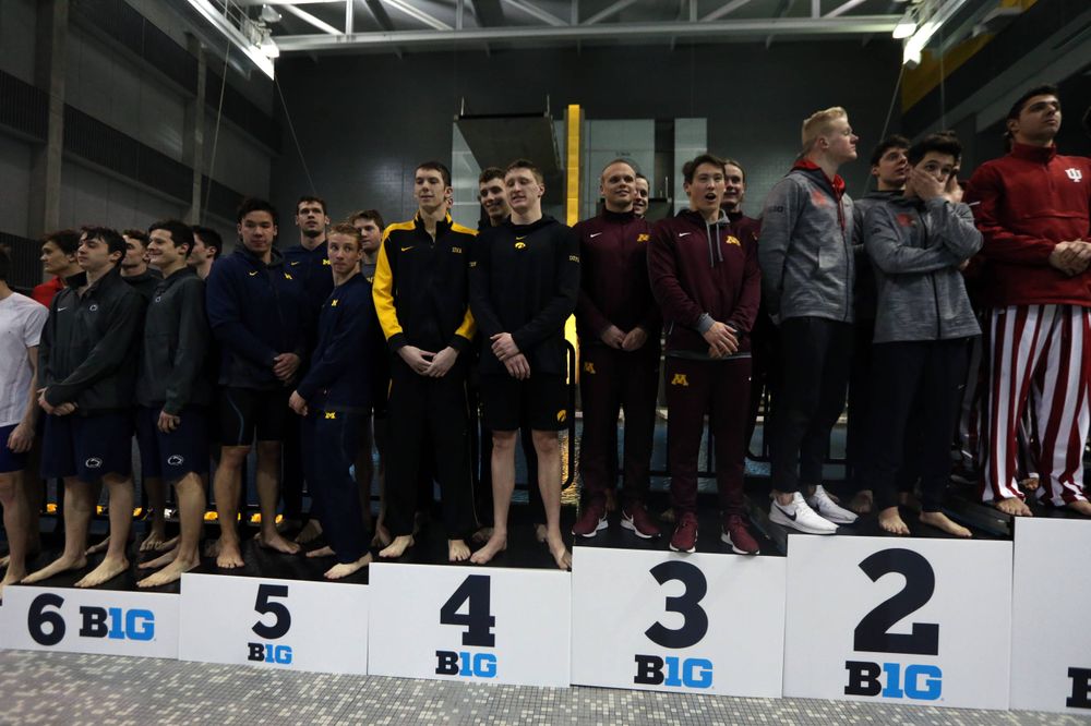 Iowa's  Joe Myhre, Jack Smith, Will Scott, and Steve Fiolic after the 200-yard freestyle relay race  Friday, March 1, 2019 at the Campus Recreation and Wellness Center. (Lily Smith/hawkeyesports.com)