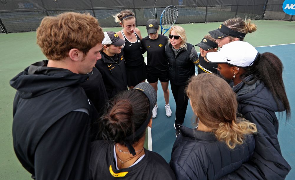 Iowa head coach Sasha Schmid talks with her team after their match against Rutgers at the Hawkeye Tennis and Recreation Complex in Iowa City on Friday, Apr. 5, 2019. (Stephen Mally/hawkeyesports.com)
