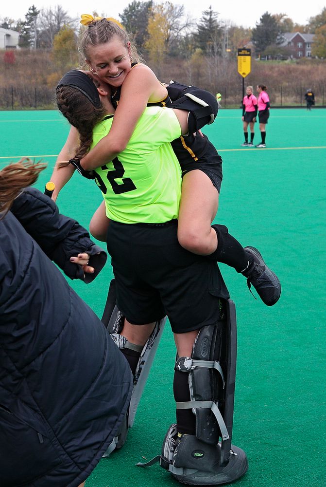 Iowa’s Maddy Murphy (26) jumps into the arms of Grace McGuire (62) after winning their game at Grant Field in Iowa City on Saturday, Oct 26, 2019. (Stephen Mally/hawkeyesports.com)