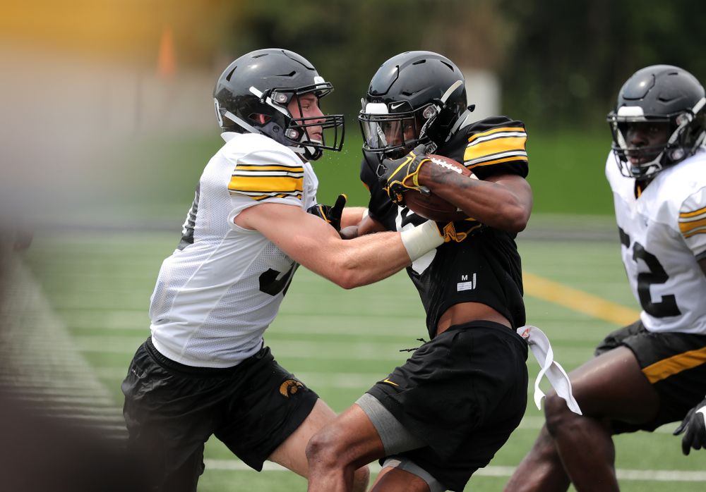 Iowa Hawkeyes defensive back Jake Gervase (30) and wide receiver Ihmir Smith-Marsette (6) during the third practice of fall camp Sunday, August 5, 2018 at the Kenyon Football Practice Facility. (Brian Ray/hawkeyesports.com)