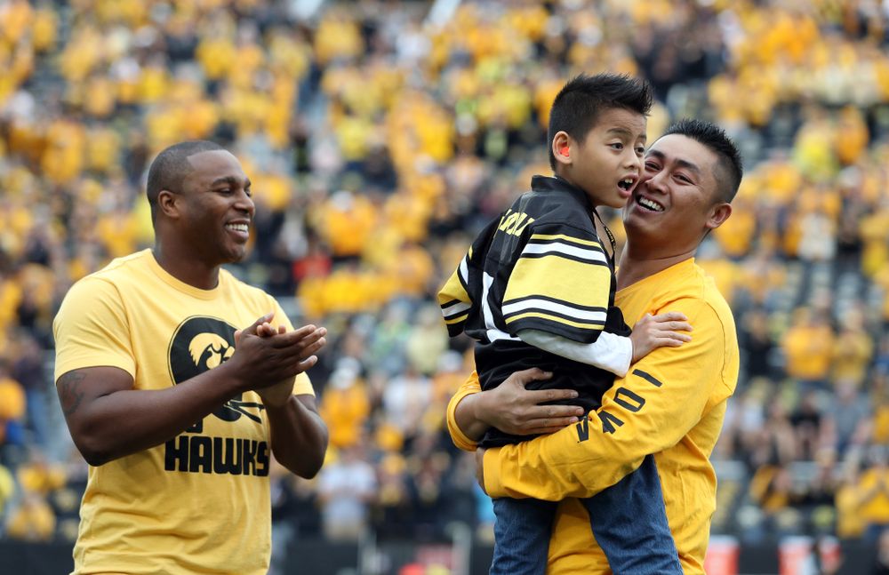 Stead Family ChildrenÕs Hospital Kid Captain Enzo Thongsoum and honorary captain Miguel Merrick before the Iowa Hawkeyes game against Middle Tennessee State Saturday, September 28, 2019 at Kinnick Stadium. (Max Allen/hawkeyesports.com)