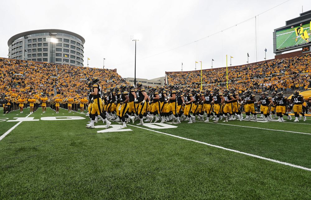 The Hawkeyes swarm as they take the field before their game at Kinnick Stadium in Iowa City on Saturday, Sep 28, 2019. (Stephen Mally/hawkeyesports.com)