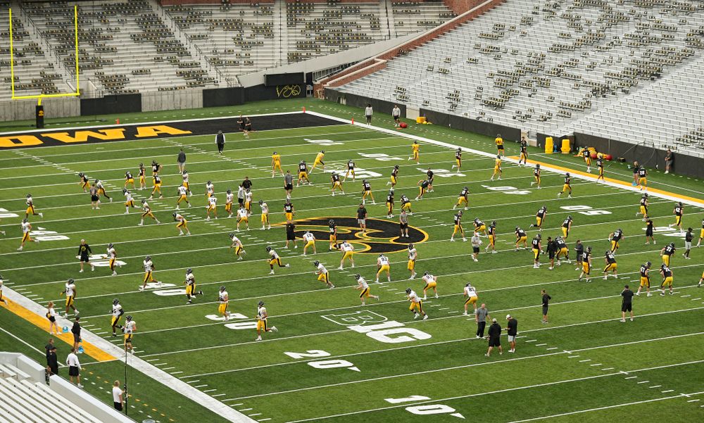 The Iowa Hawkeyes warm up during Fall Camp Practice No. 12 at Kinnick Stadium in Iowa City on Thursday, Aug 15, 2019. (Stephen Mally/hawkeyesports.com)