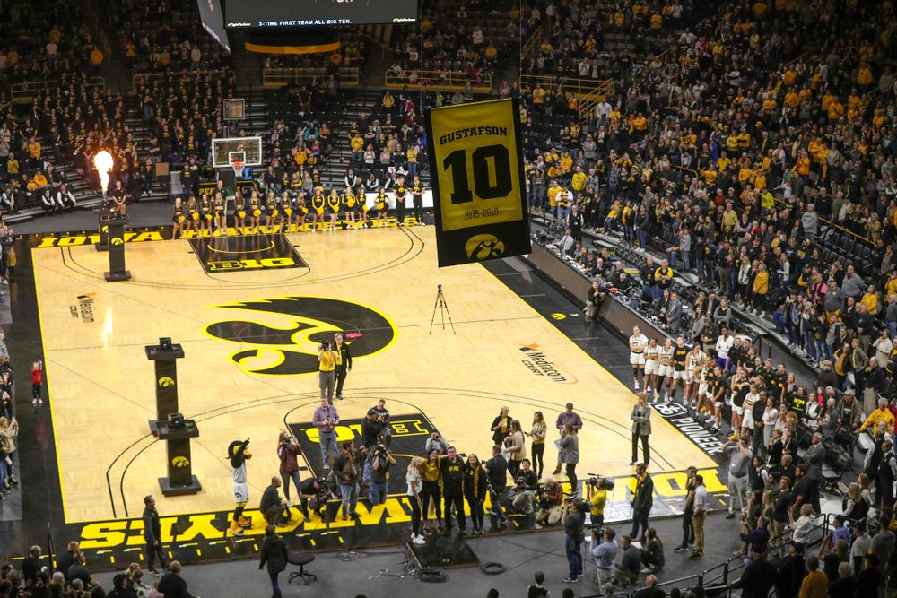 Fans watch with Megan Gustafson as her number is raised to the rafters during her jersey retirement ceremony at Carver-Hawkeye Arena in Iowa City on Sunday, January 26, 2020. (Stephen Mally/hawkeyesports.com)