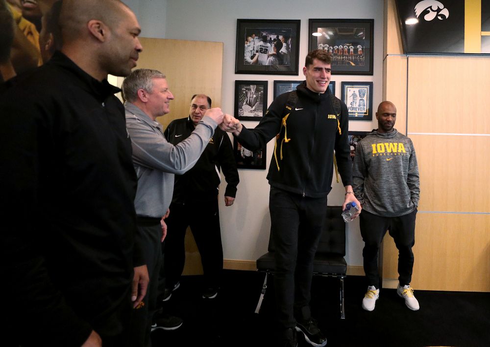 Iowa Hawkeyes forward Luka Garza (55) fist bumps assistant coach Kirk Speraw after finding out he has been named the Big Ten Player of the Year Monday, March 9, 2020 at Carver-Hawkeye Arena. (Brian Ray/hawkeyesports.com)