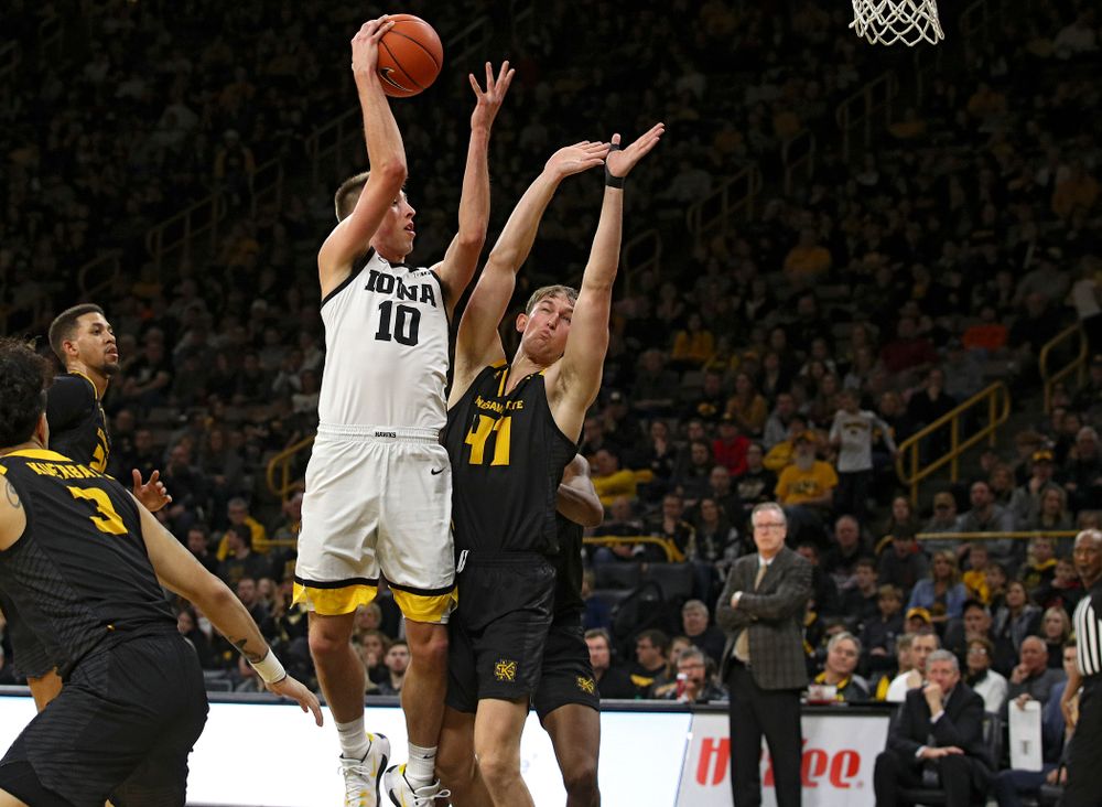 Iowa Hawkeyes guard Joe Wieskamp (10) passes the ball to center Luka Garza (not pictured) who dunks it during the second half of their their game at Carver-Hawkeye Arena in Iowa City on Sunday, December 29, 2019. (Stephen Mally/hawkeyesports.com)