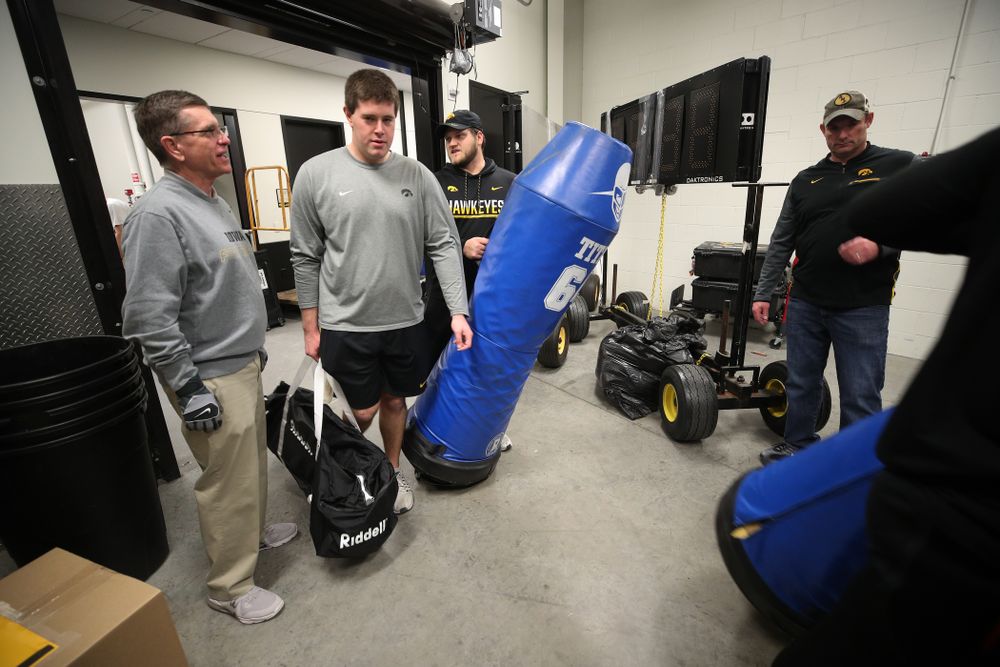 Members fo the Hawkeye Football equipment staff and managers load equipment onto the truck bound for Tampa for the Outback Bowl Wednesday, December 19, 2018 at the Hansen Football Performance Center.  (Brian Ray/hawkeyesports.com)