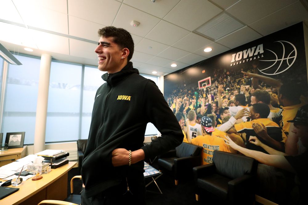 Iowa Hawkeyes forward Luka Garza (55) smiles after finding out that he has been named the Big Ten Player of the Year Monday, March 9, 2020 at Carver-Hawkeye Arena. (Brian Ray/hawkeyesports.com)