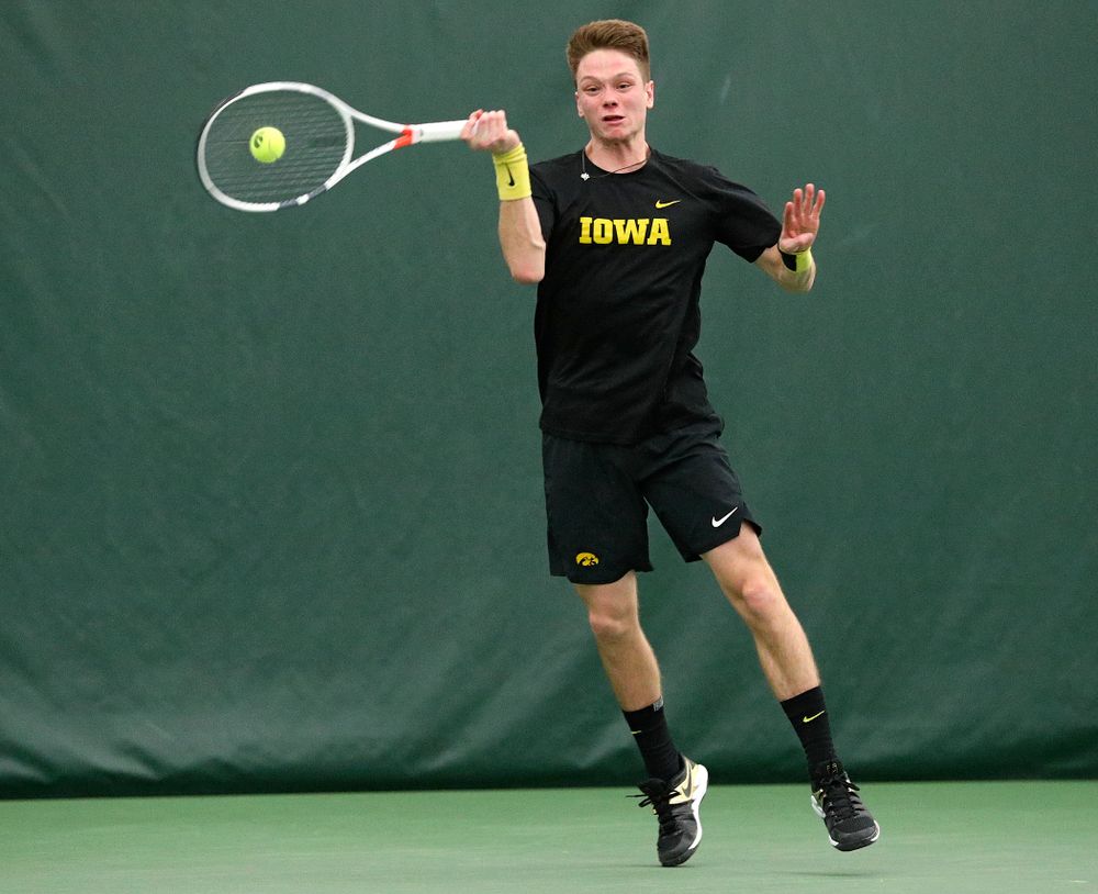 Iowa’s Jason Kerst returns a shot during his singles match at the Hawkeye Tennis and Recreation Complex in Iowa City on Friday, February 14, 2020. (Stephen Mally/hawkeyesports.com)