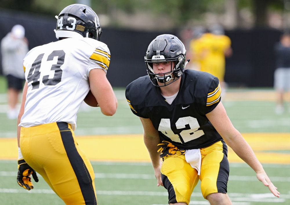 Iowa Hawkeyes tight end Shaun Beyer (42) eyes linebacker Dillon Doyle (43) as they run a drill during Fall Camp Practice No. 10 at the Hansen Football Performance Center in Iowa City on Tuesday, Aug 13, 2019. (Stephen Mally/hawkeyesports.com)