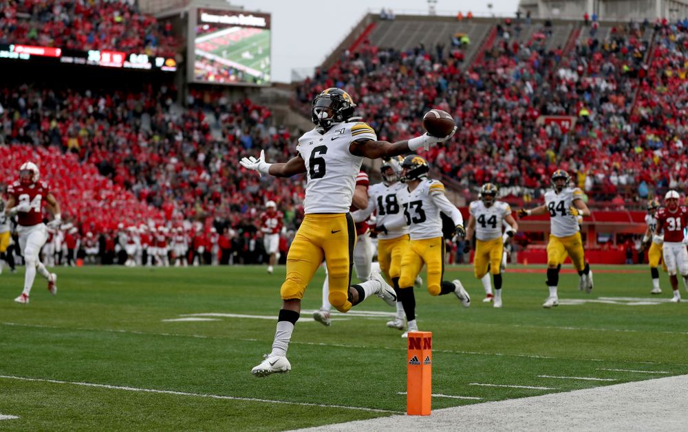 Iowa Hawkeyes wide receiver Ihmir Smith-Marsette (6) returns a kickoff for a touchdown against the Nebraska Cornhuskers Friday, November 29, 2019 at Memorial Stadium in Lincoln, Neb. (Brian Ray/hawkeyesports.com)