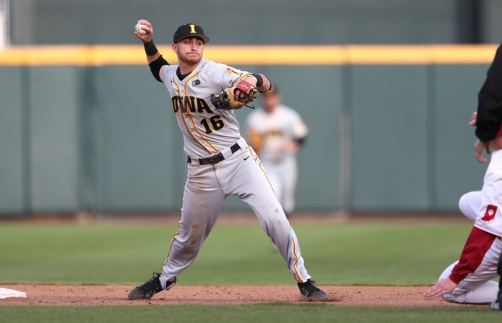 Iowa Hawkeyes Tanner Wetrich (16) turns a double play against the Indiana Hoosiers in the first round of the Big Ten Baseball Tournament Wednesday, May 22, 2019 at TD Ameritrade Park in Omaha, Neb. (Brian Ray/hawkeyesports.com)