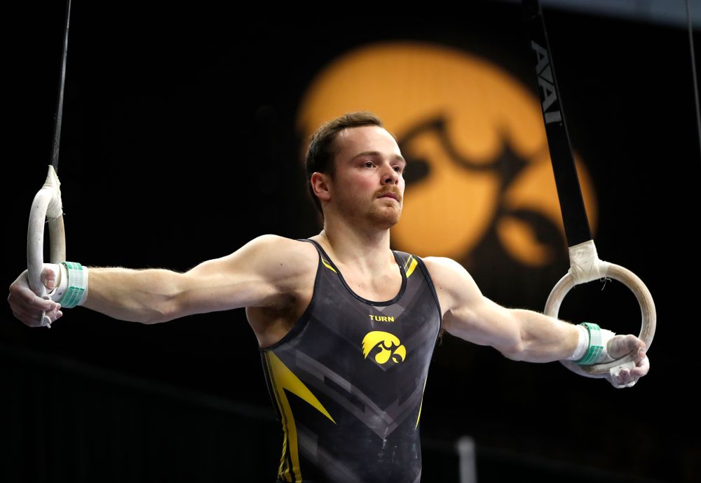 Dylan Ellsworth competes on the rings against Minnesota and Air Force 