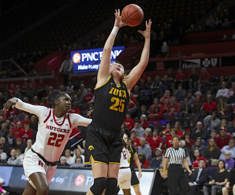 Iowa forward/center Monika Czinano (25) pulls in a pass during the fourth quarter of their game at the Rutgers Athletic Center in Piscataway, N.J. on Sunday, March 1, 2020. (Stephen Mally/hawkeyesports.com)